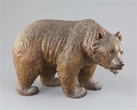 A Black Forest carved wood model of a bear, c.1900, 12in. height 8.5in.